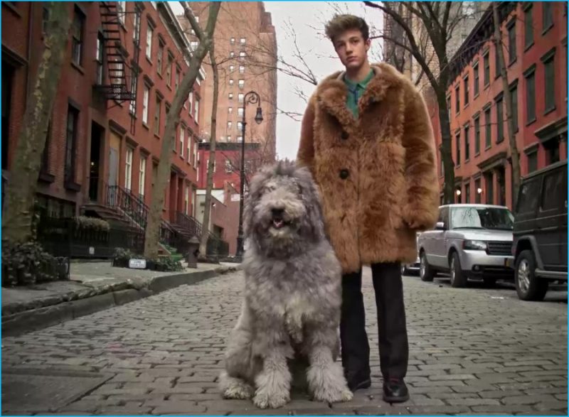 Cameron Dallas embraces an over the top look in a shearling Coach jacket.