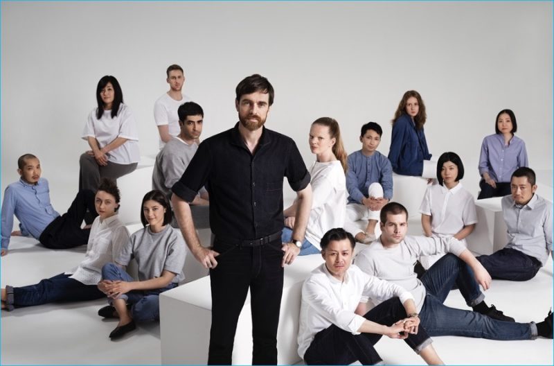 Designer Christophe Lemaire poses for a picture with UNIQLO Paris R&D Center design team.