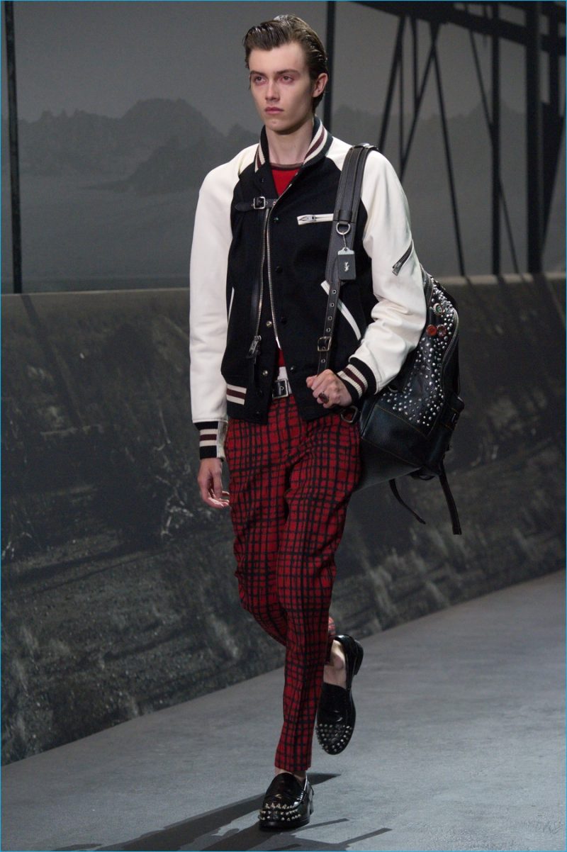 Coach champions the varsity jacket, bringing it into a bad boy realm with its red, black and white color palette.