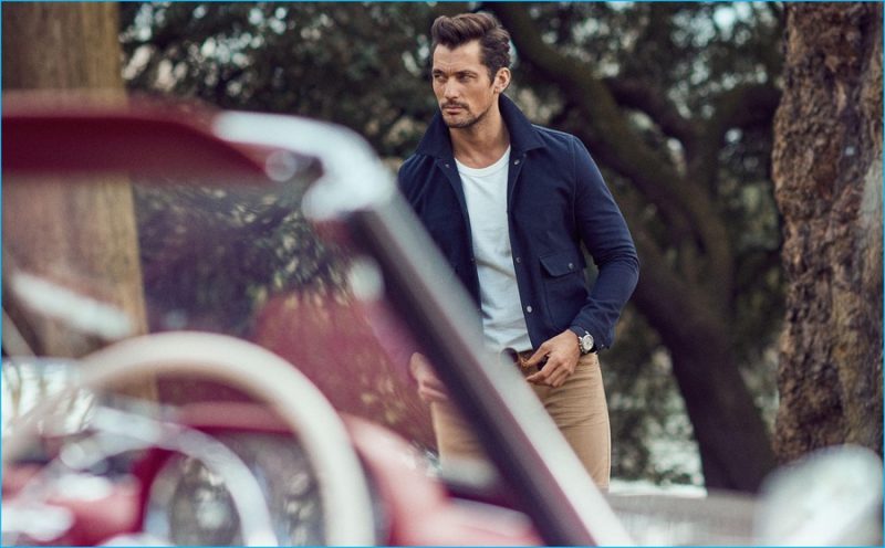 David Gandy embraces a fitted look of classics, sporting a Harrington jacket over a casual crewneck t-shirt.