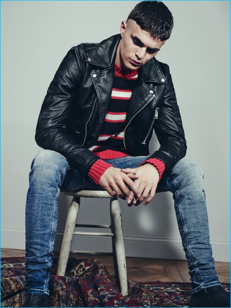 Diego Villarreall rocks a striped jumper with skinny denim jeans and a leather biker jacket.