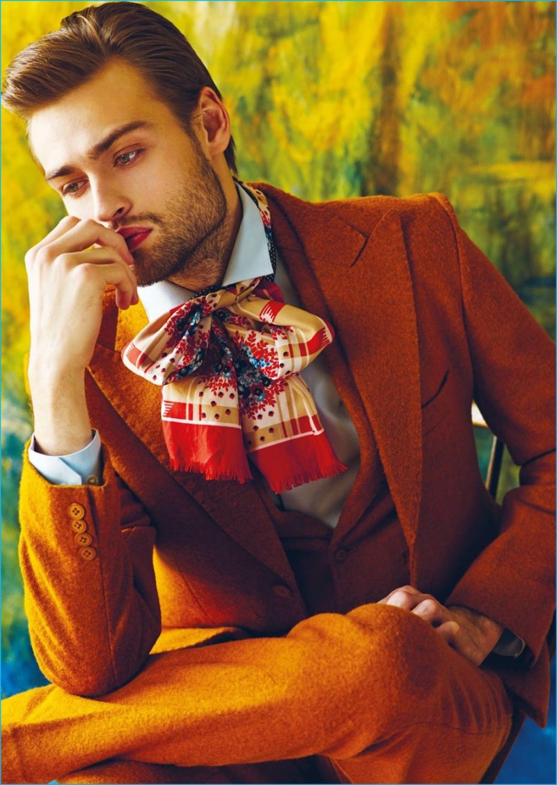 Douglas Booth dons a rich orange suit from Helen Anthony with a Theory shirt.
