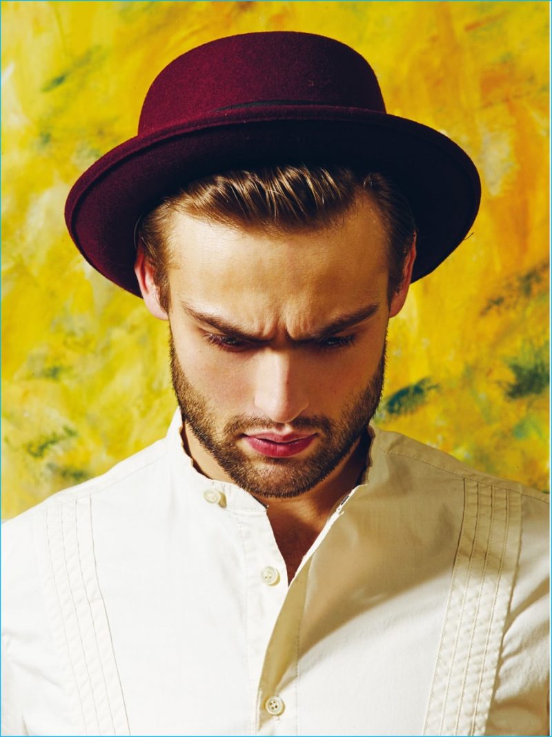 Donning a felt hat, Douglas Booth is photographed by Ram Shergill for The Protagonist. 