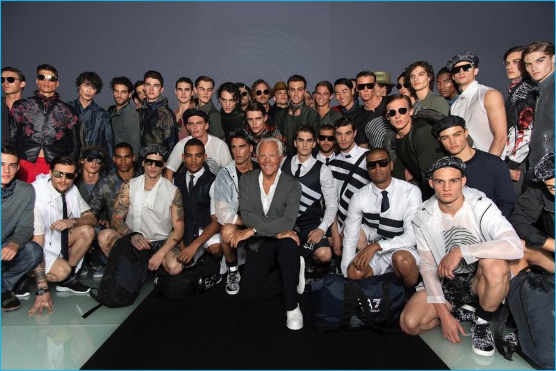 Giorgio Armani poses with the models who walked his spring-summer 2017 show for Emporio Armani.