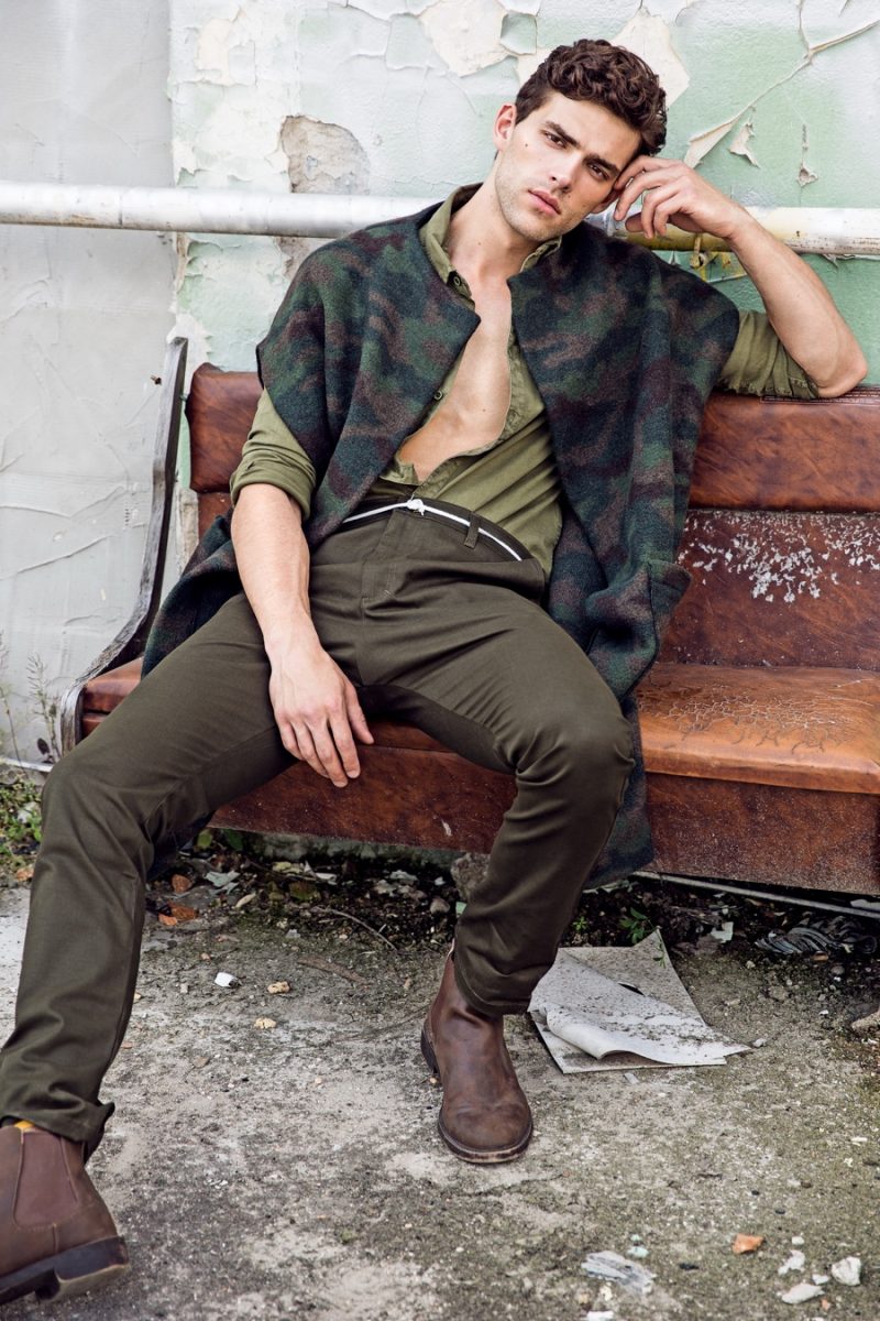 Frederik wears shirt Zara, boots Diesel, pants and camouflage vest Buffet Clothing.