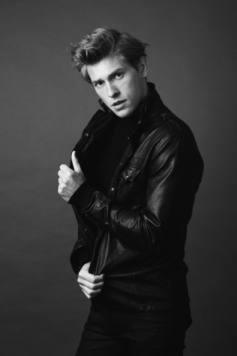 William wears turtleneck Hugo Boss, pants Calvin Klein Jeans and leather jacket Diesel.