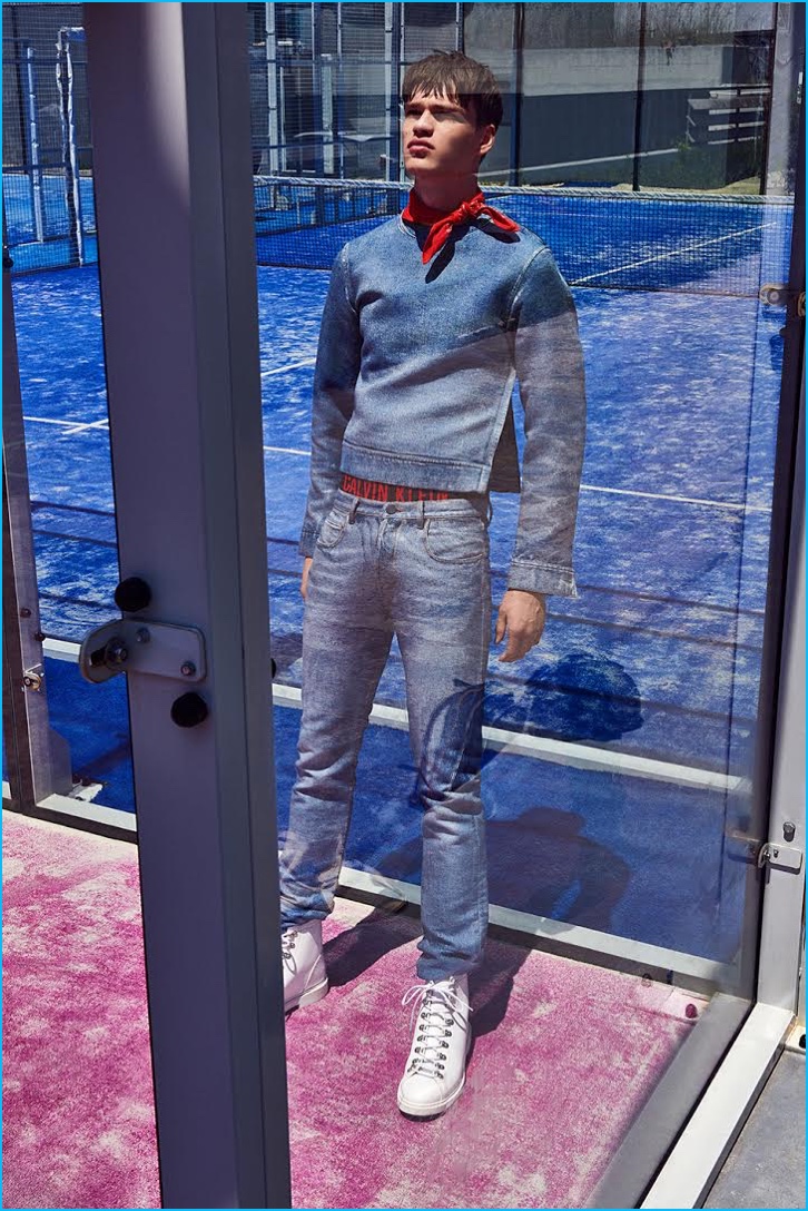 Filip Hrivnak dons a casual but chic blue number from Calvin Klein Collection, accented with Givenchy boots.
