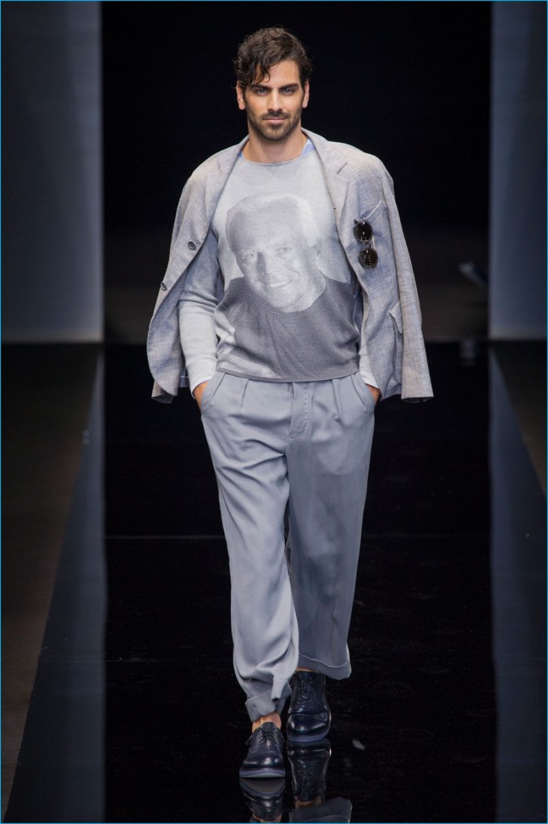 Nyle DiMarco takes to the catwalk in a sweater adorned with an image of Giorgio Armani.