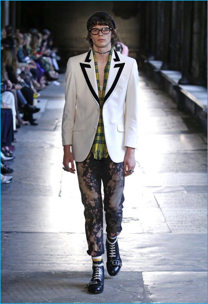 Gucci juxtaposes aesthetics, pairing bleached denim with a white dinner jacket.