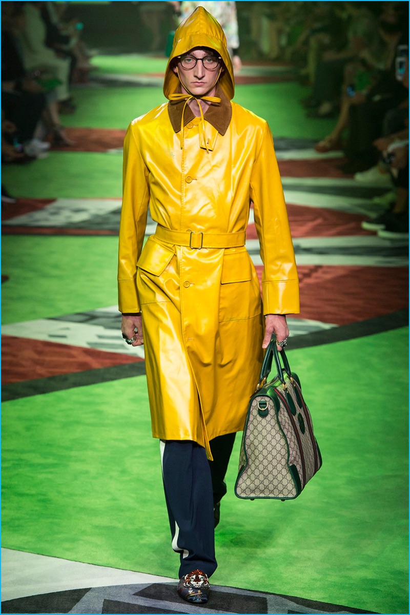 Gucci enjoys a pop of color with a bright yellow hooded coat.