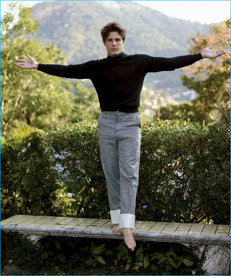 Appearing in Harper's Bazaar España, Romulo Neto is pictured with arms wide open.