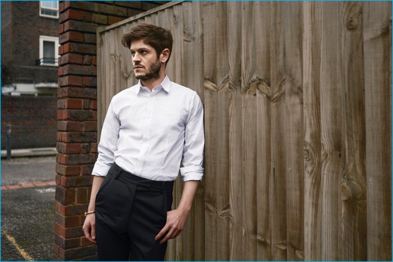 Iwan Rheon connects with The Laterals in a shirt and trousers from Matthew Miller with a Miansai bracelet.