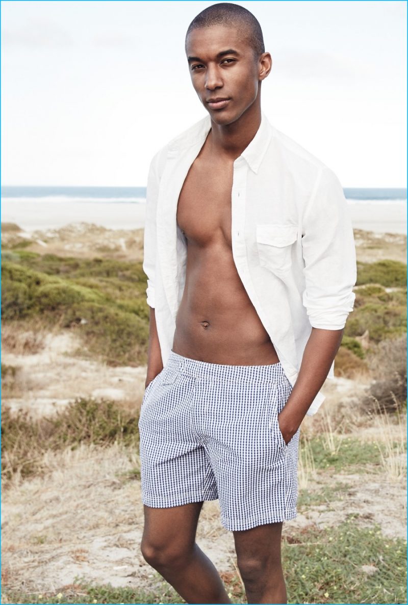 Claudio Monteiro goes casual in a J.Crew white shirt and tab swim shorts.