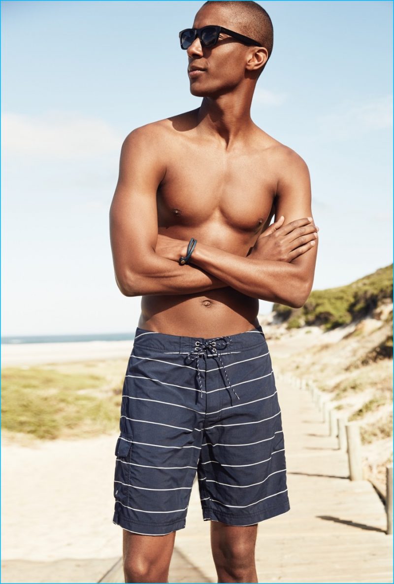 Claudio Monteiro embraces board shorts in a striped navy style from J.Crew.