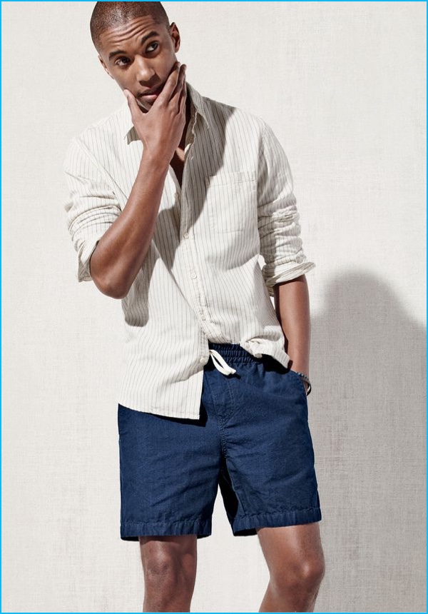 Claudio Monteiro models a button-down shirt with J.Crew dock shorts.