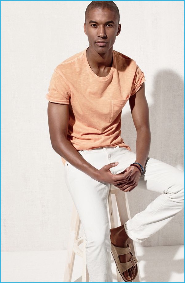 Claudio Monteiro is front and center in a garment dyed pocket tee with 484 white jeans from J.Crew with Birkenstock sandals.