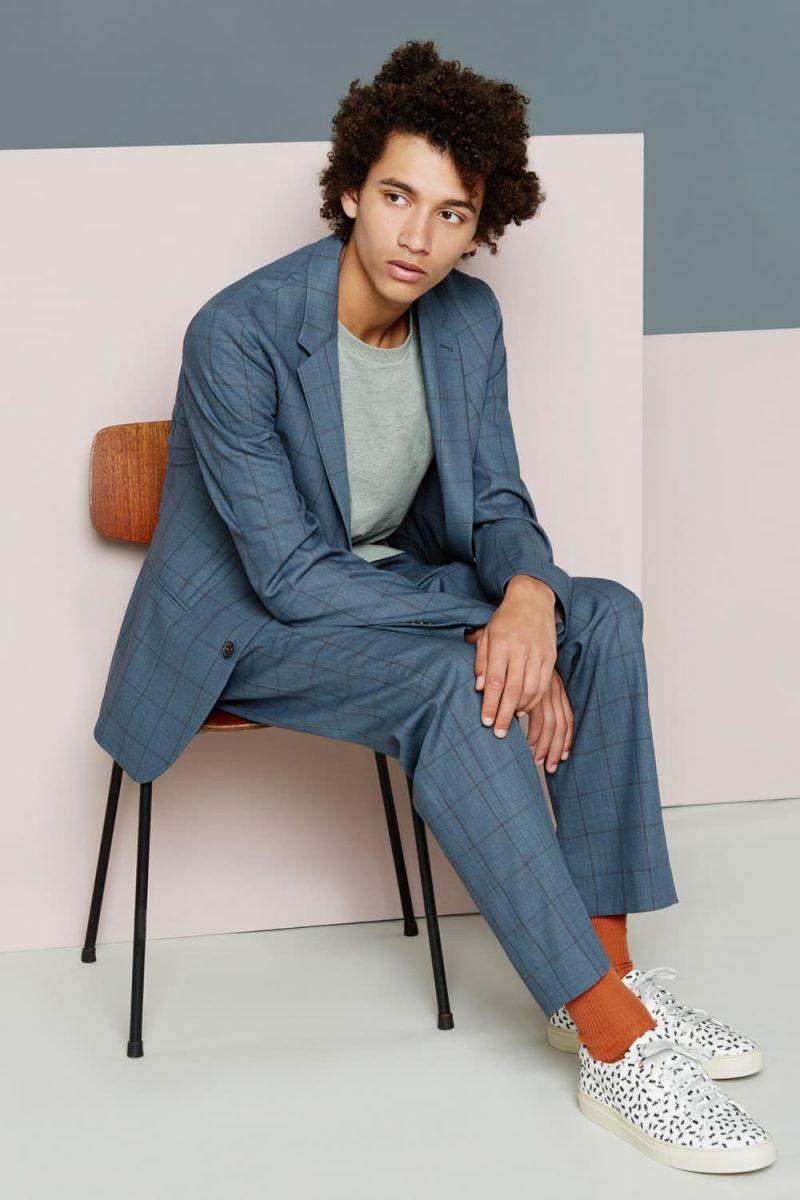 Jackson Hale is front and center in a grey Paul Smith windowpane suit.