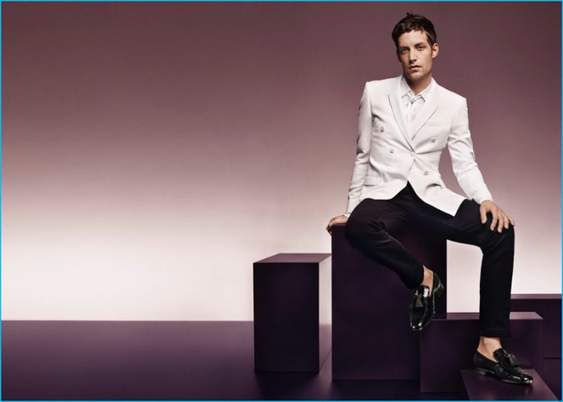Going formal, James Jagger dons a white double-breasted dinner jacket with Jimmy Choo patent leather loafers for the brand's fall-winter 2016 campaign.