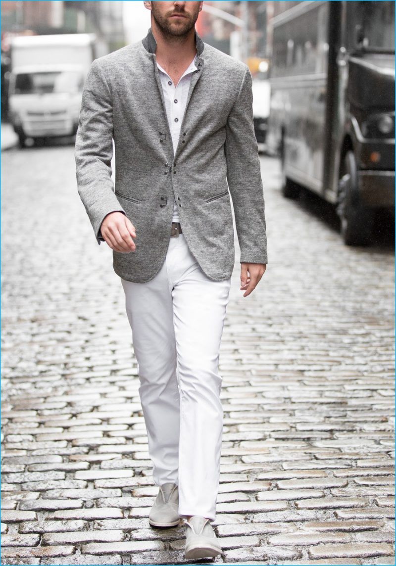 John Varvatos makes a case for chic style, pairing its white denim jeans with a grey linen blazer.