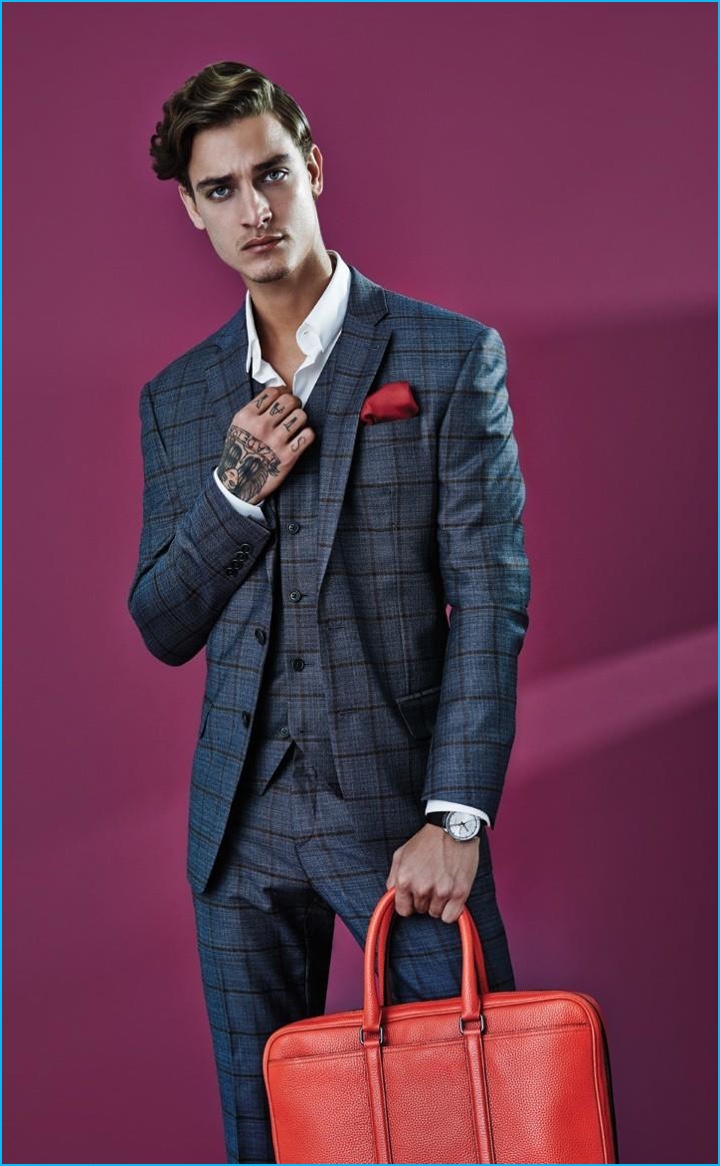 Jonathan Bellini pictured in a three-piece suit from Ricardo Almeida.