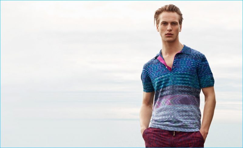 Jules Raynal wears striped-knit cotton polo shirt by Missoni. Clay swim shorts by Thorsun.