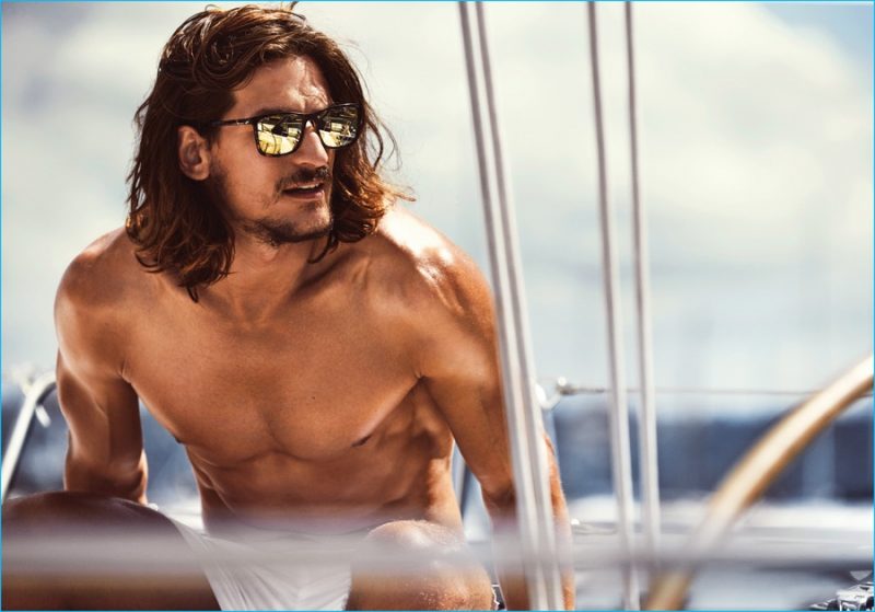 Jarrod Scott wears Le Specs Master Tamers mirrored sunglasses in coal tort. 