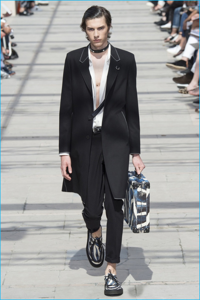 Louis Vuitton embraces sleek tailoring for spring-summer 2017, accenting it with contrast piping.