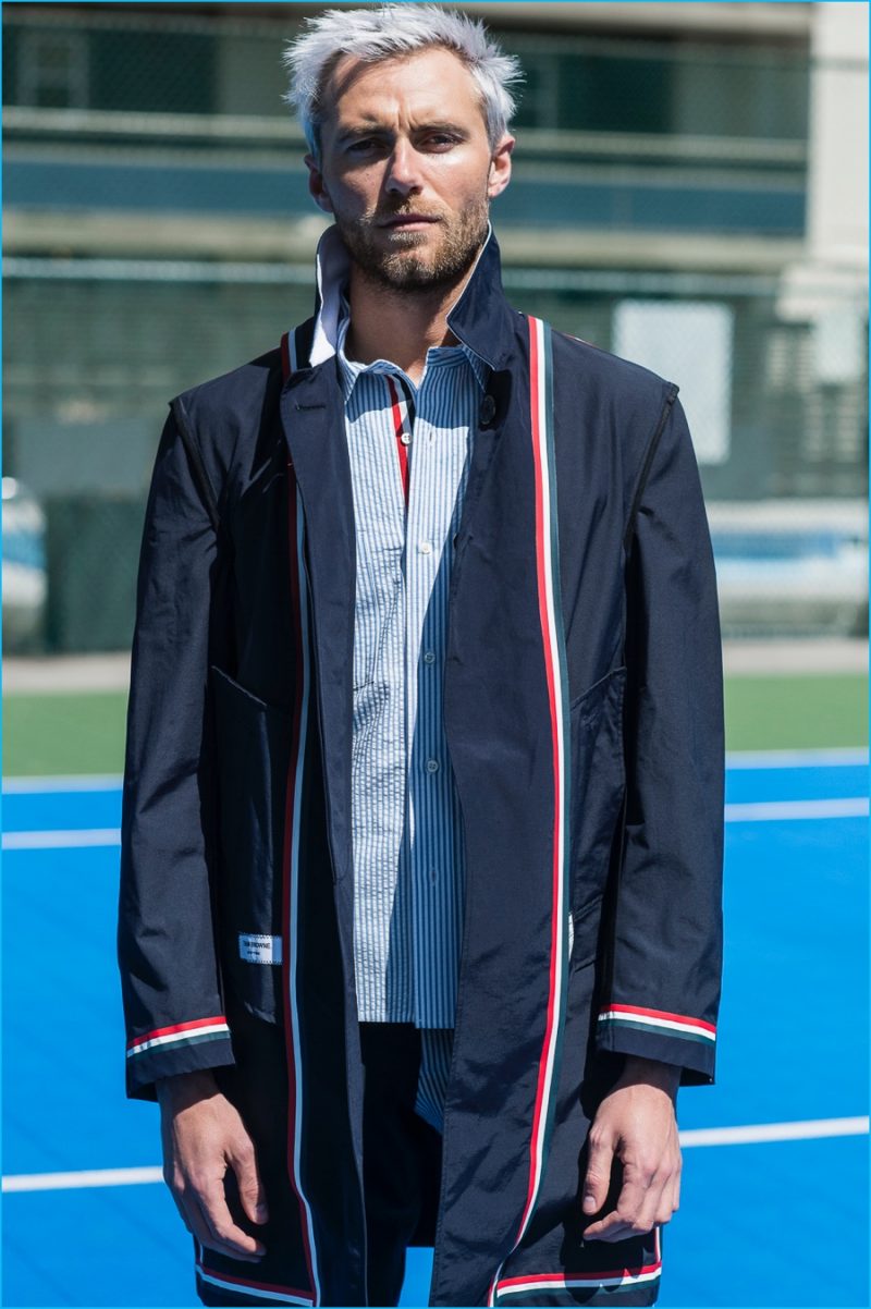 Matthew Foley poses for a picture in an ensemble from Thom Browne.