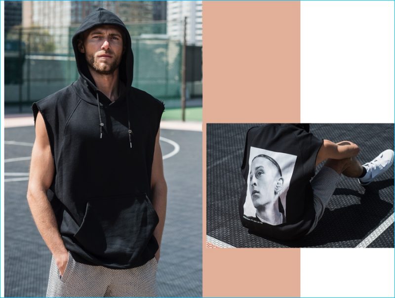 Matthew Foley sports a sleeveless hoodie and patterned shorts from Raf Simons.