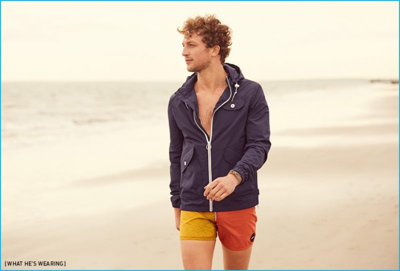 Ben Waddell goes on a beach stroll, wearing Penfield rain jacket, RVCA swim trunks, Cause and Effect wrap bracelet and Caputo & Co. cuff.
