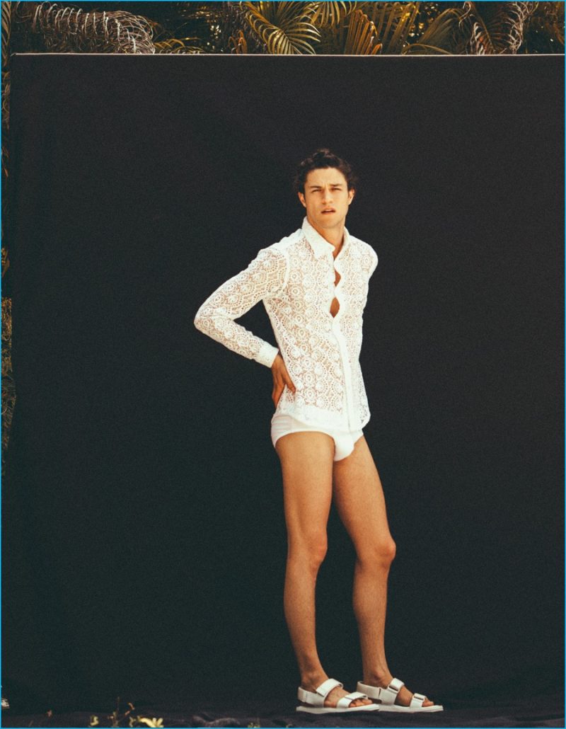 Miles McMillan wears a Burberry lace shirt with a Springfield swimsuit and Calvin Klein Collection sandals.