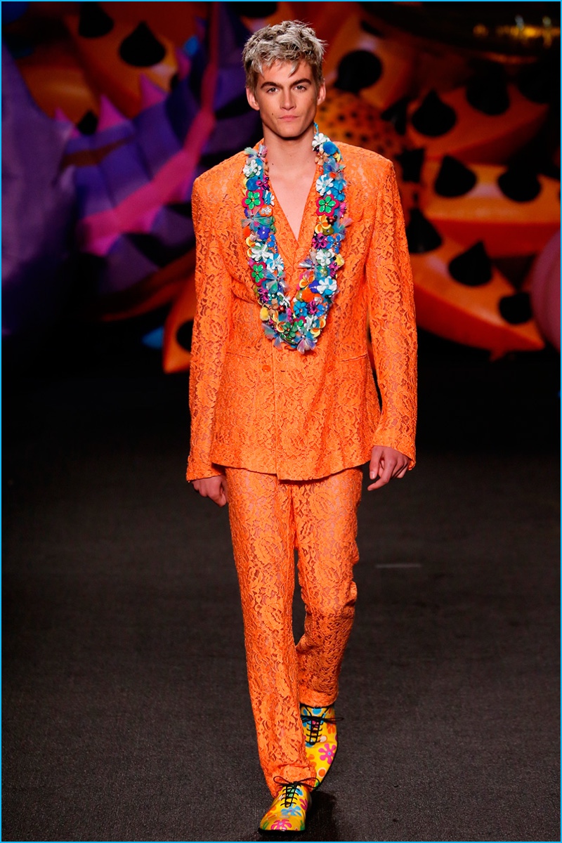 The son of Cindy Crawford, Presley Gerber has a standout moment in a bold orange Moschino suit.