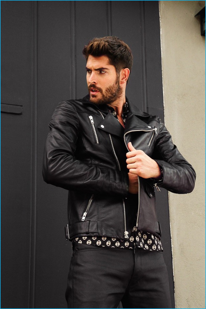 Nick Bateman plays it cool in a leather biker jacket.