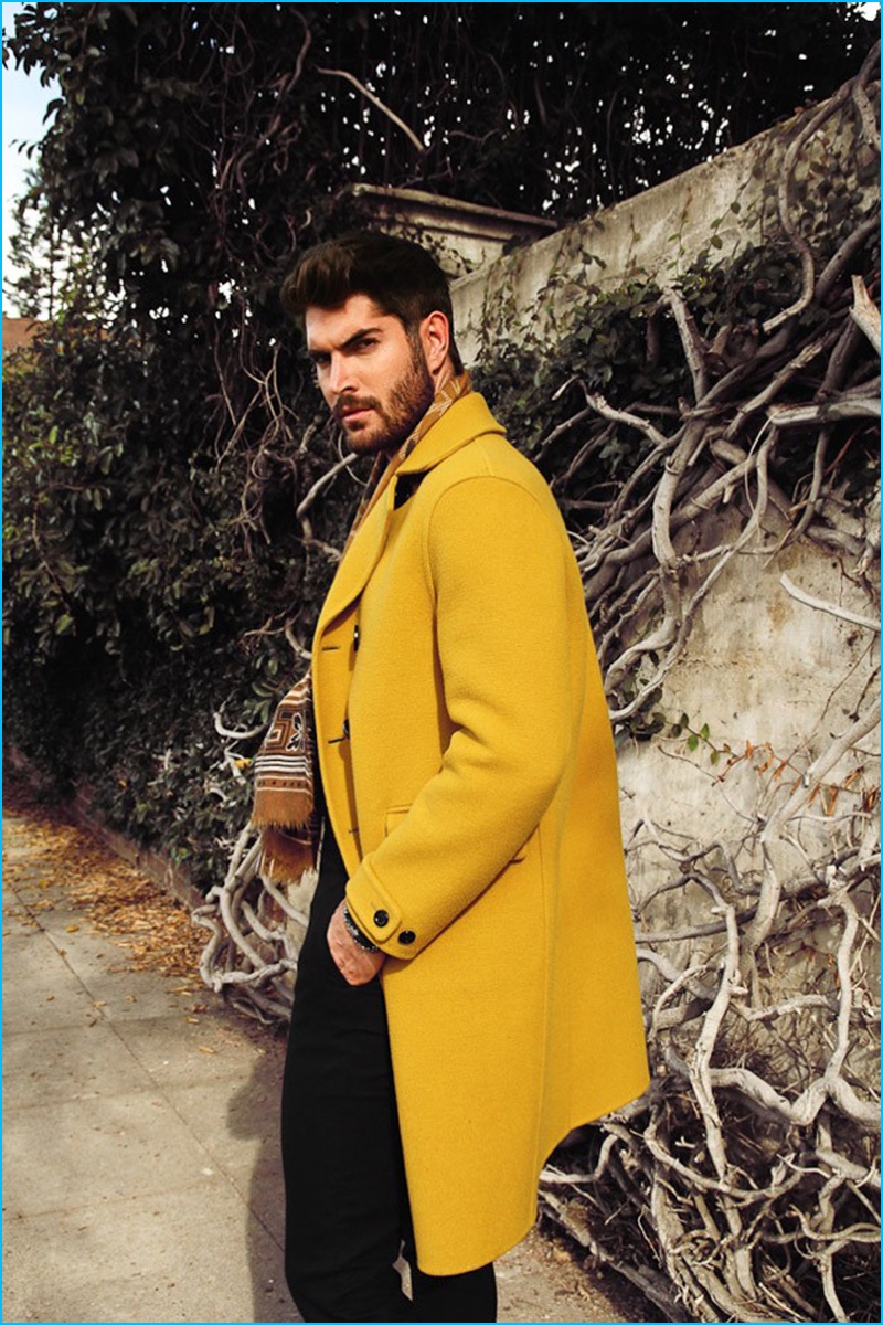 Nick Bateman is a dashing vision in a yellow coat for the pages of L'Officiel Hommes Ukraine.