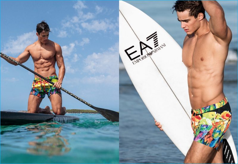 Pietro Boselli dons colorful swimwear for EA7 as he paddle boards. 