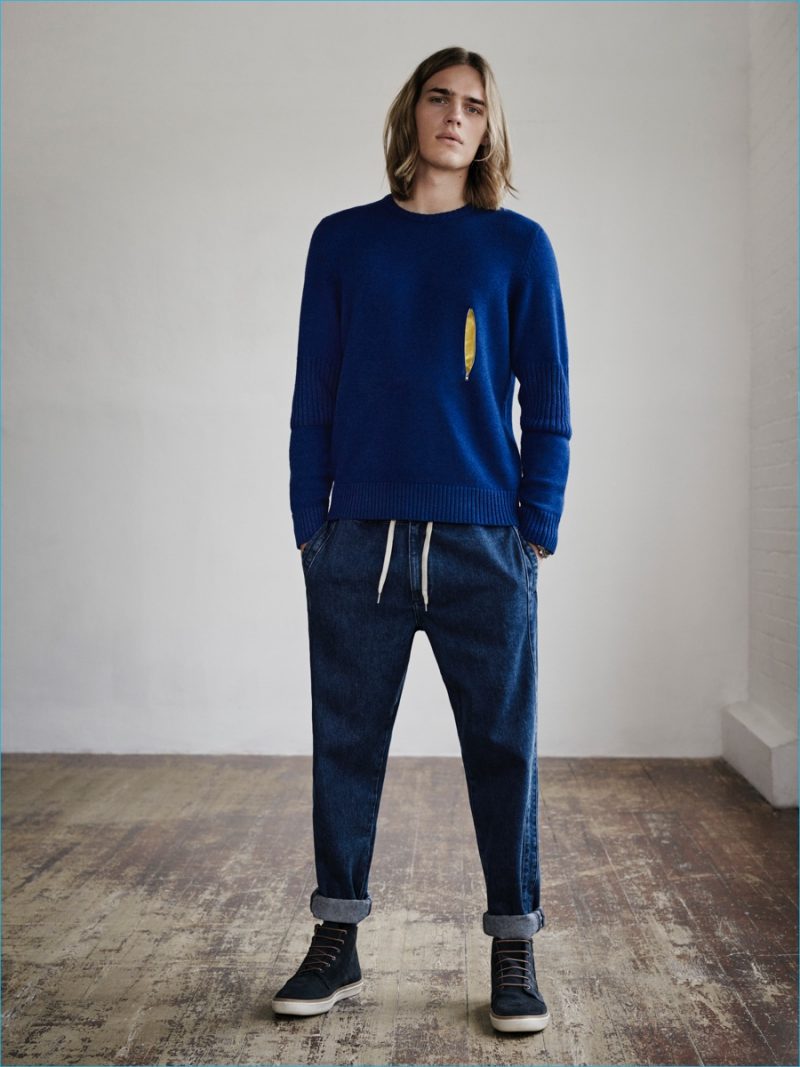 Ton Heukels is a vision of leisure in a zip front sweater and joggers from YMC x River Island collection.