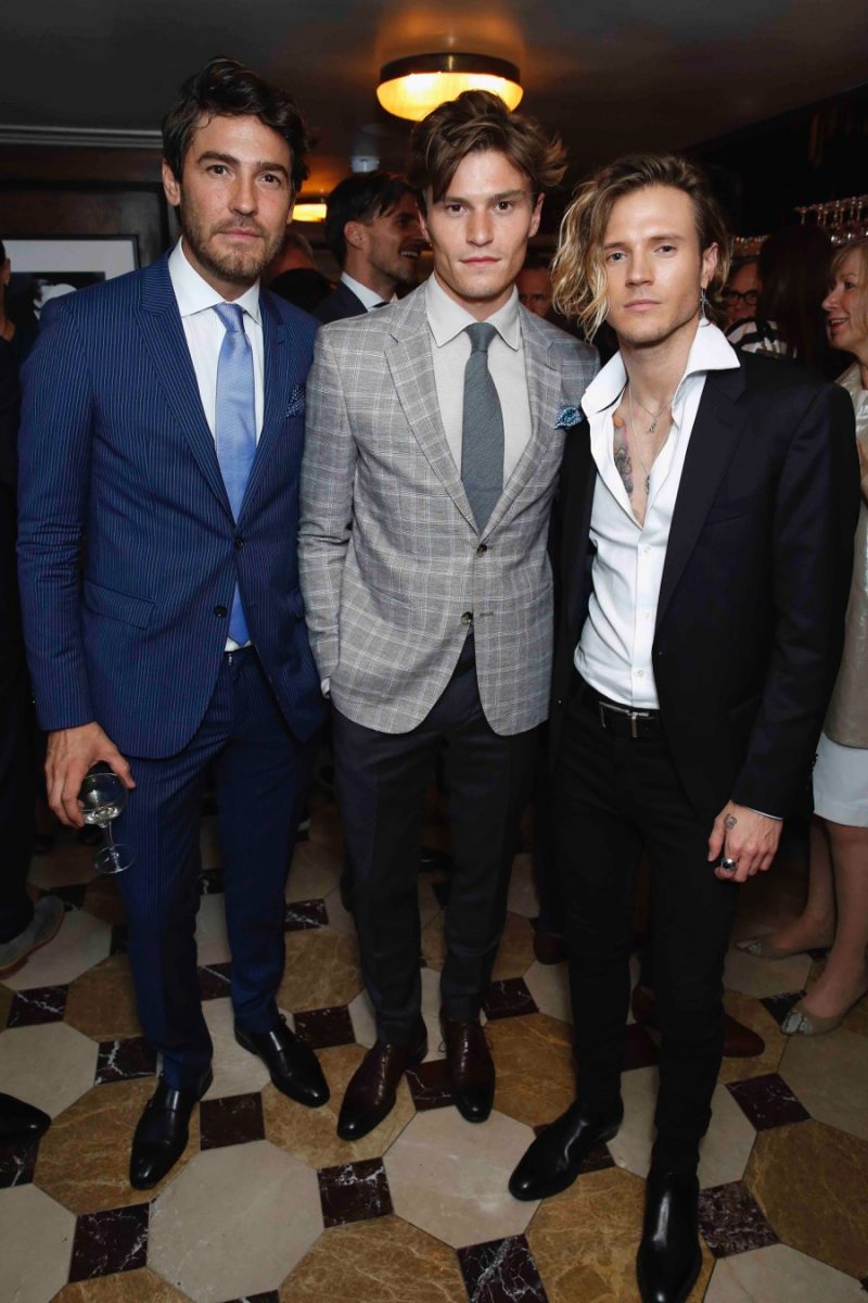 Robert Konjic, Oliver Cheshire and Dougie Poynter pictured at a Tommy Hilfiger dinner during London Collections: Men.