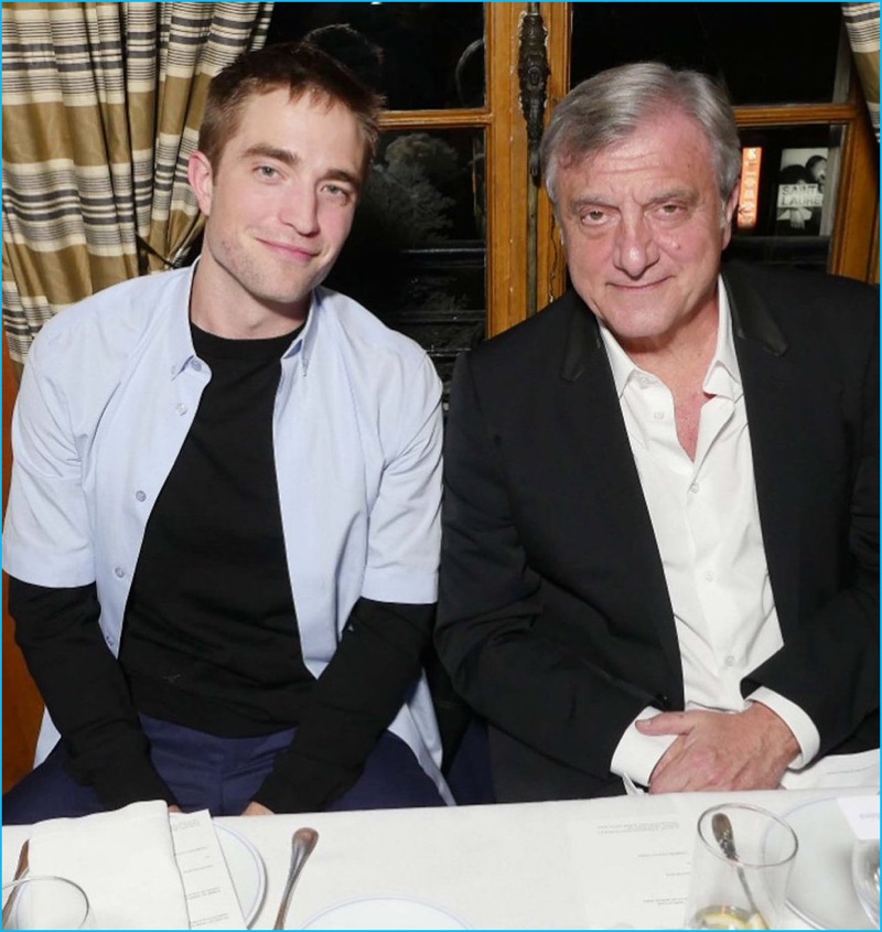 Robert Pattinson poses for a picture with Christian Dior Couture chief executive, Sidney Toledano.