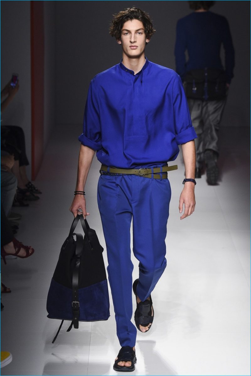 Salvatore Ferragamo has a monochromatic number with a sleek silhouette in royal blue.
