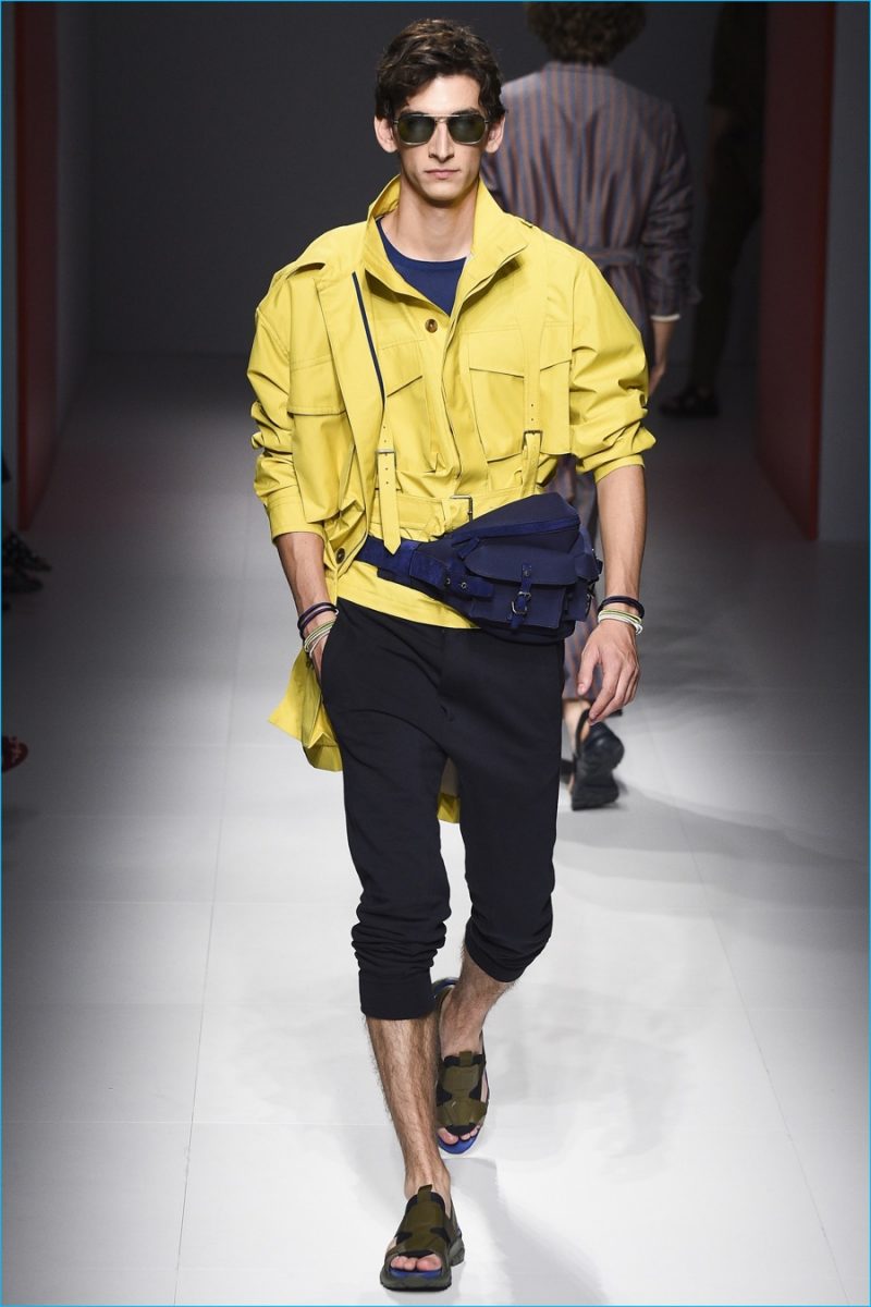 Salvatore Ferragamo adds a splash of color to its spring-summer 2017 outing with a bright yellow jacket.