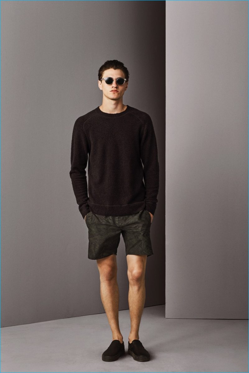 Eli Hall models a tone on tone sweatshirt with shorts from Saturdays NYC's fall-winter 2016 collection.