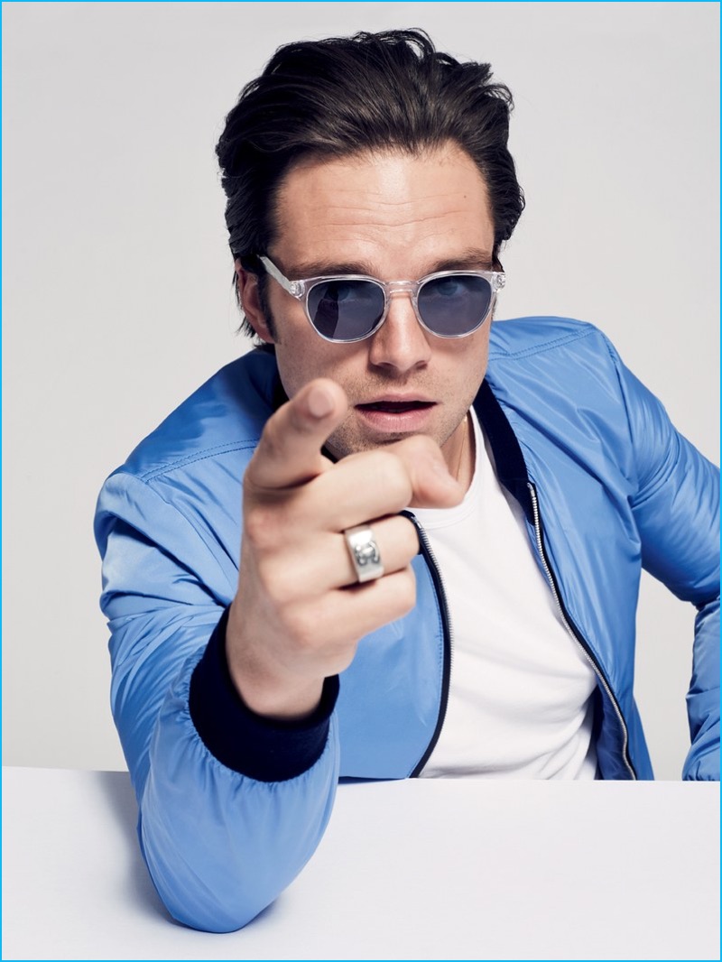 Sebastian Stan charms in Paul Smith Spectacles sunglasses and a light blue Dolce & Gabbana bomber jacket.