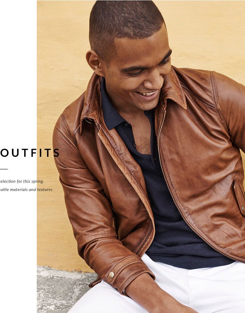 Terence Telle is all smiles in a brown leather jacket with a textured polo shirt, white pants and espadrilles from Massimo Dutti.