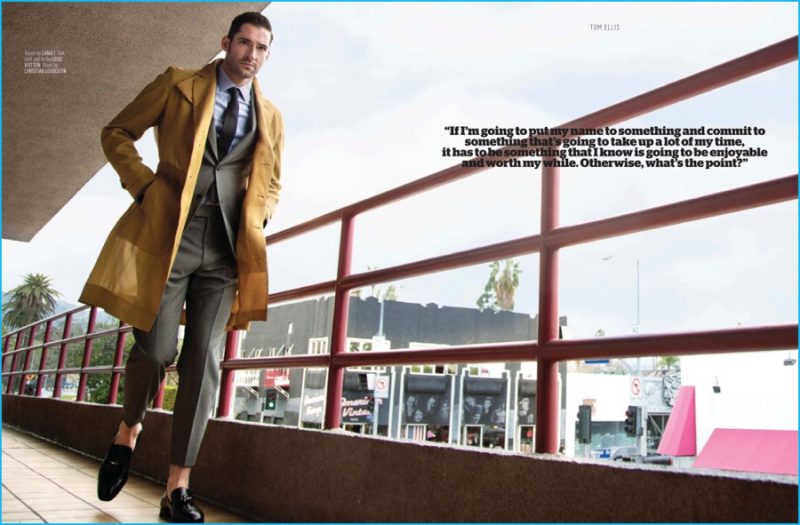 Tom Ellis heads out in a mustard yellow coat from Canali, worn over a Louis Vuitton suit.