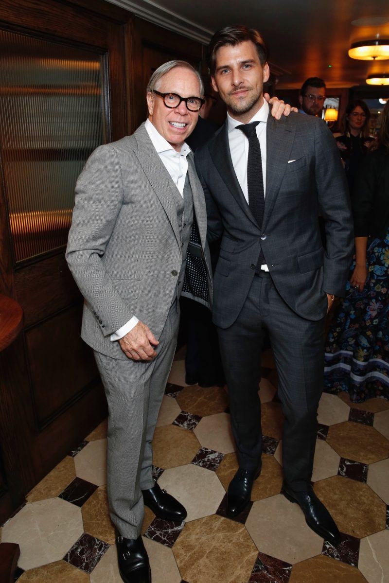 Designer Tommy Hilfiger and model Johannes Huebl pictured at a Tommy Hilfiger dinner during London Collections: Men.