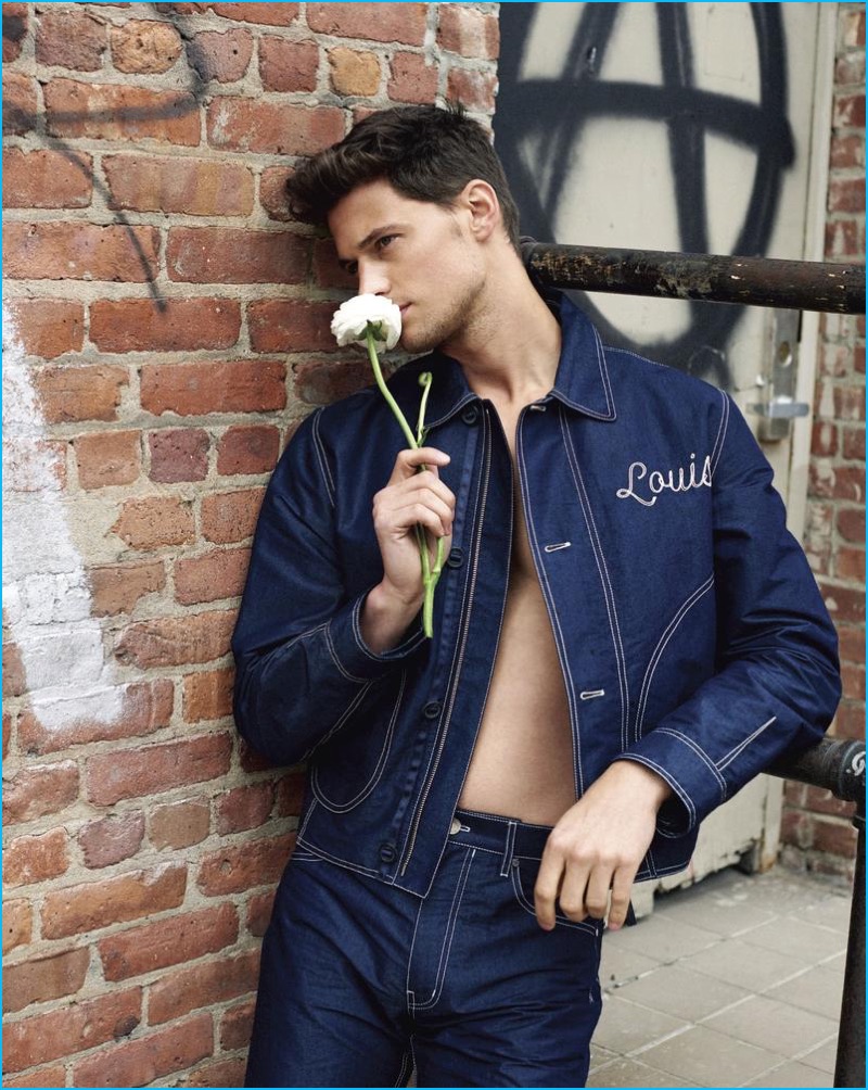 Garrett Neff dons a denim look from French fashion house Louis Vuitton.