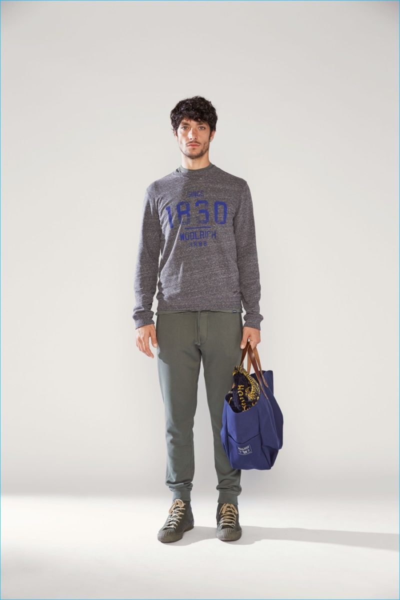 Woolrich John Rich & Bros. exudes rugged charm with laid-back joggers and a graphic pullover.