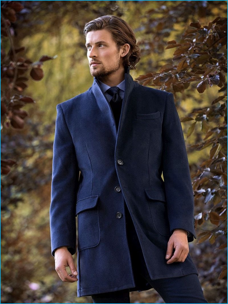 Wouter Peelen dons a sharp, navy single-breasted coat from Scapa's fall-winter 2016 collection.