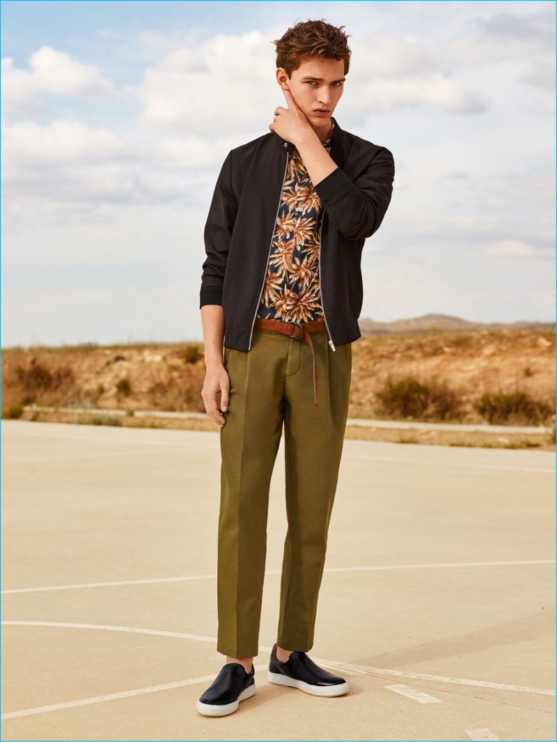 The New Khaki: Otto Lotz sports a plain bomber jacket with darted trousers and basic sneakers from Zara Man.
