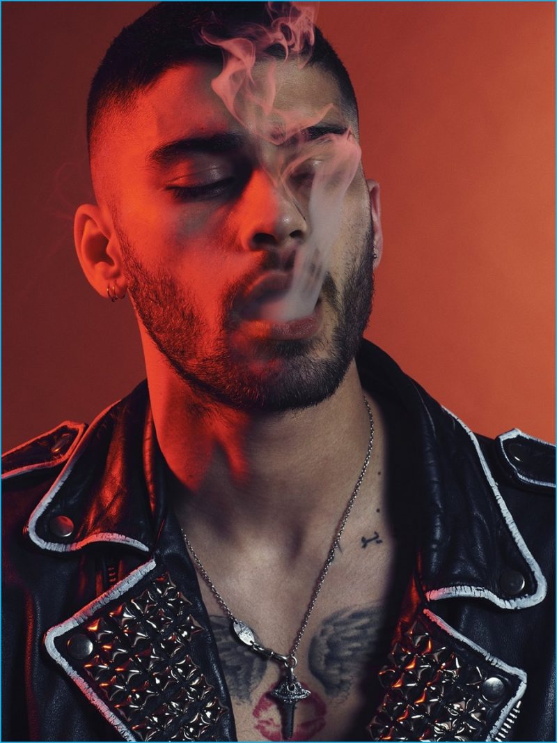 Zayn Malik rocks a black and white leather biker jacket from Enfants Riches Déprimés for Paper magazine.